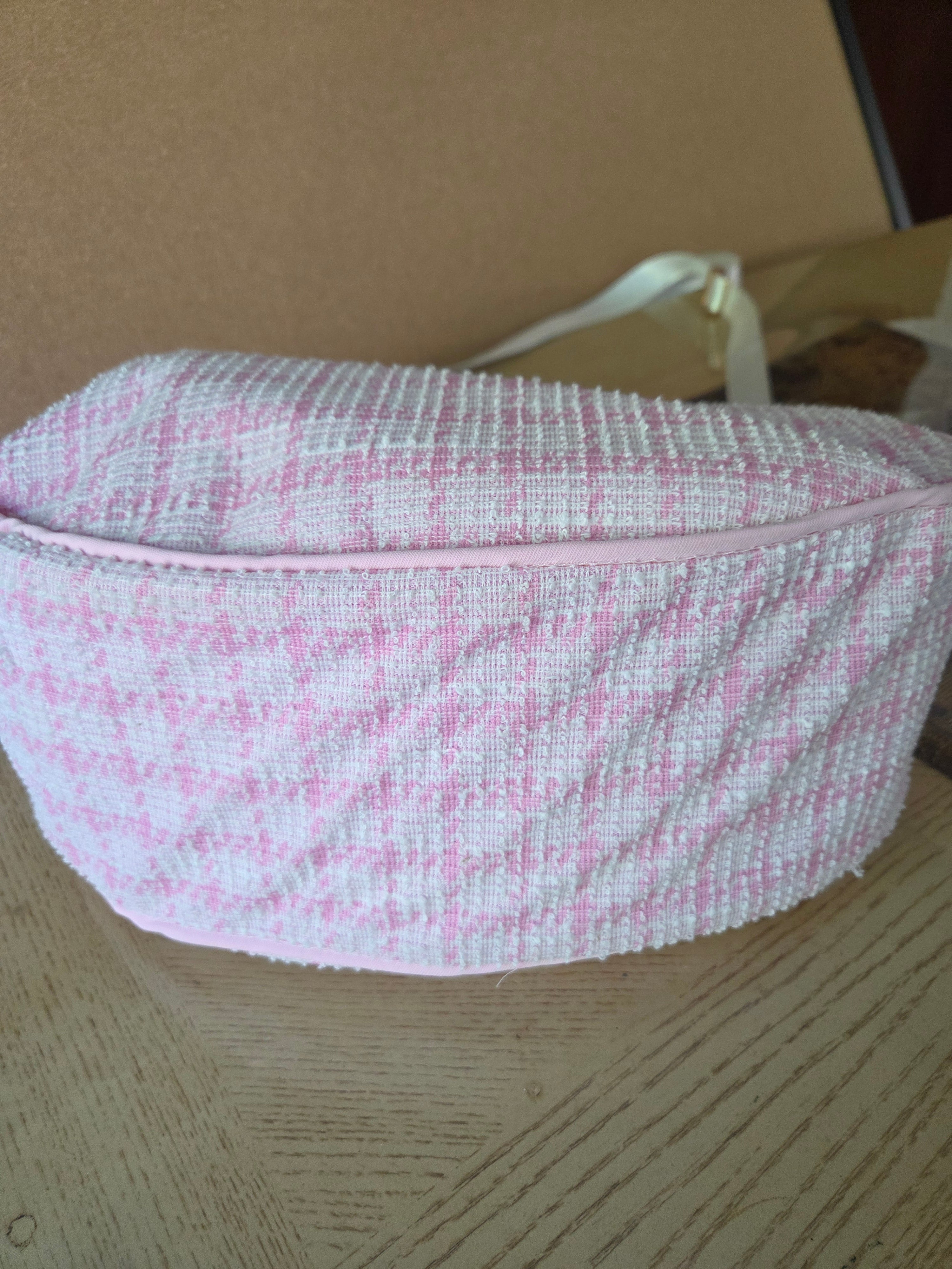 Handmade pink textured shoulder bag.
